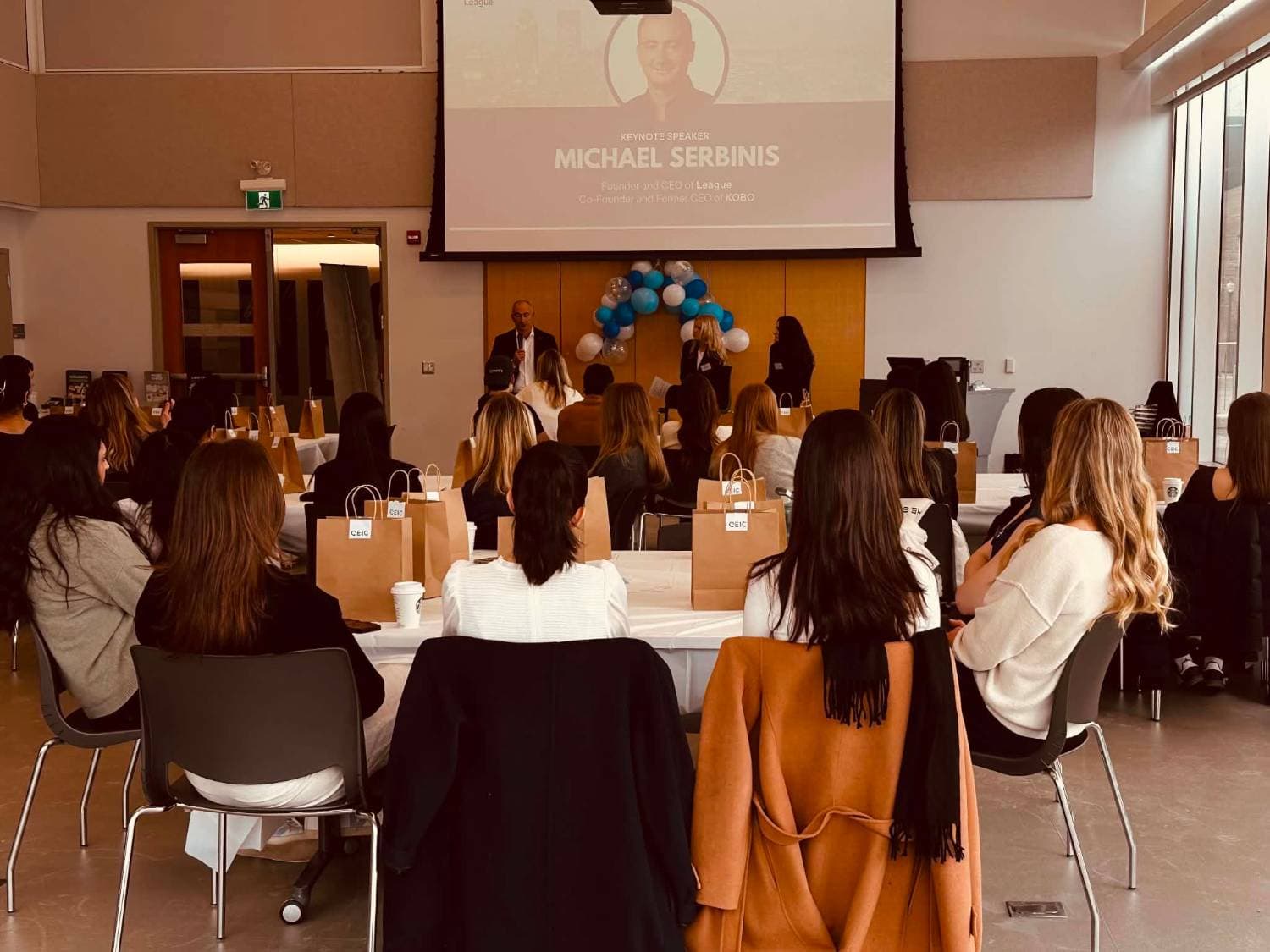 Students listening to a keynote speaker at a QEIC event